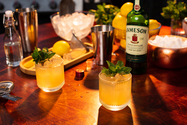 two jameson smashes served as brunch drinks alongside a bottle of jameson irish whiskey