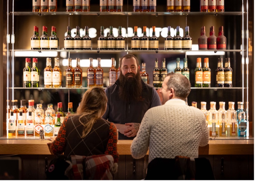 two people enjoying a whiskey tasting tour at the midleton distillery, co. cork