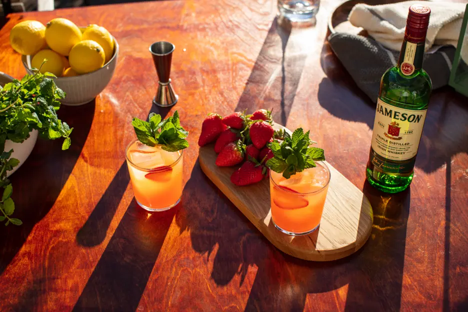 cocktails garished with fresh mint and strawberries